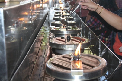 Fill the oil to Candle  to extend your long life in Buddhist Temple